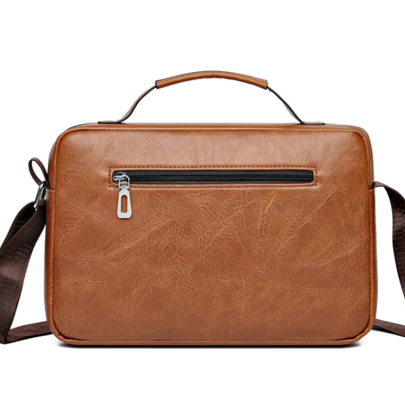 A brown faux leather crossbody bag with a zipper and leather strap is shown against a white background.