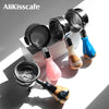 A collection of stainless steel bottomless espresso portafilters for various machines.