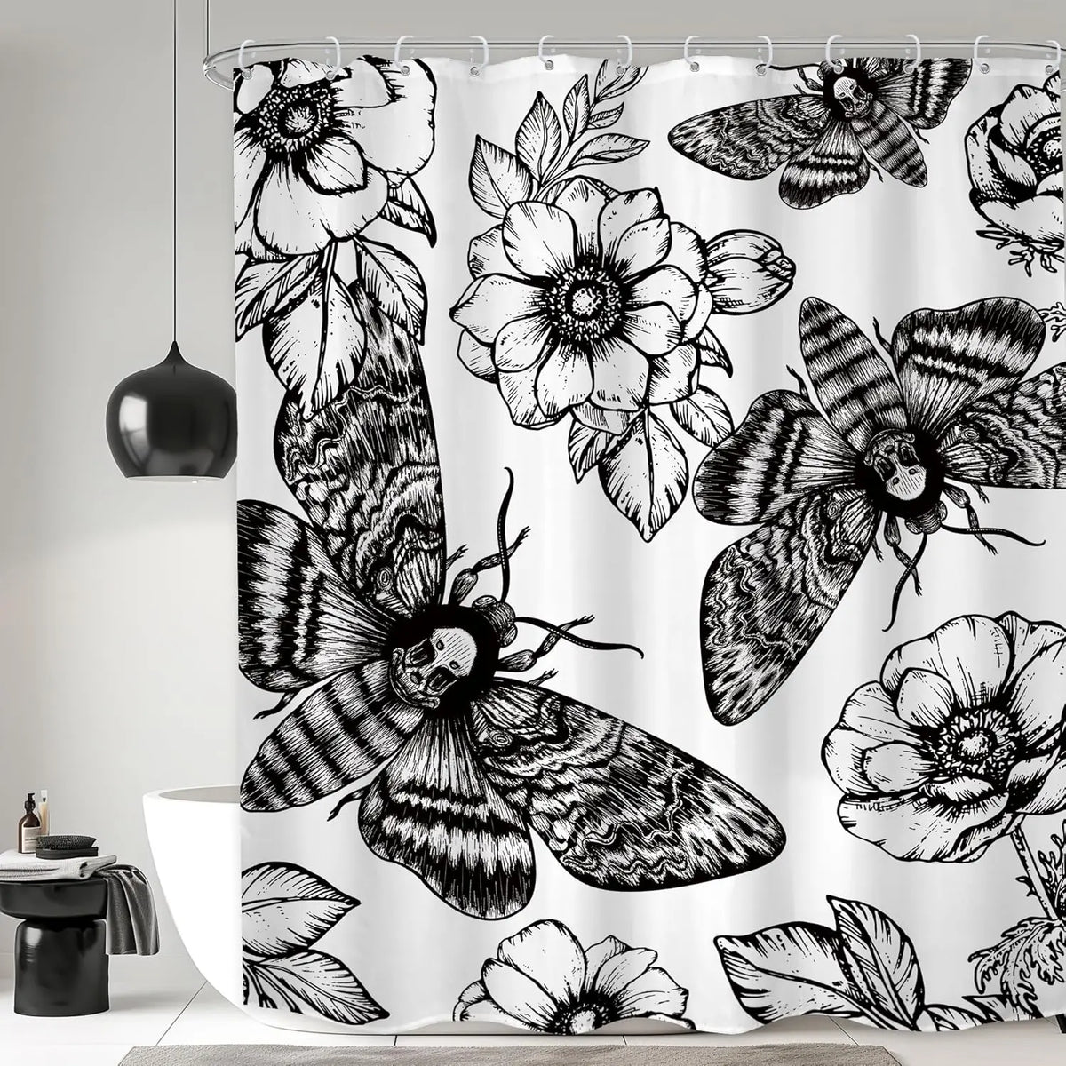 Black and white gothic skull shower curtain featuring moth and floral designs