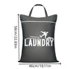 A black fabric laundry bag with the word LAUNDRY printed in white text on the front.