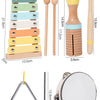 A set of wooden percussion instruments including a maraca, drumsticks, and a small mallet.