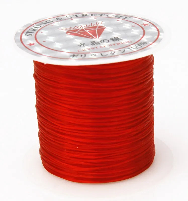 A spool of red strong and stretchy crystal string for beading and jewelry making