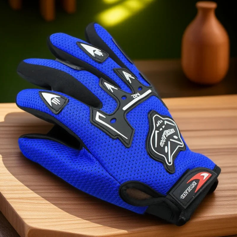 A pair of blue and black full finger nylon riding gloves resting on a wooden surface.