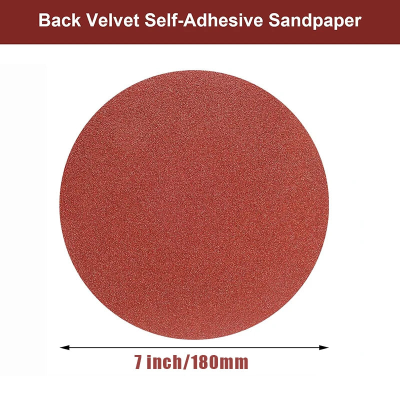 A circular piece of reddish-brown velvet self-adhesive sandpaper measuring 7 inches (180mm).
