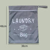 A gray portable waterproof laundry bag with a zipper and a label reading LAUNDRY Bag