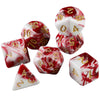 A set of seven polyhedral dice in red and white marbled designs.