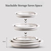 Stackable white silicone washbasins shown in various stacks, demonstrating space-saving storage.
