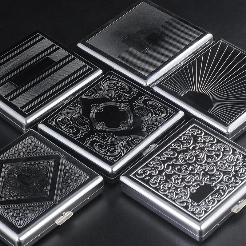 A collection of classic stainless steel cigarette cases with various embossed patterns and designs.