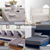 A collection of bedding items including tablecloths, a crib sheet, and a fitted sheet.