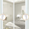 A white magnetic screen door with a mesh curtain is shown in a bedroom setting.