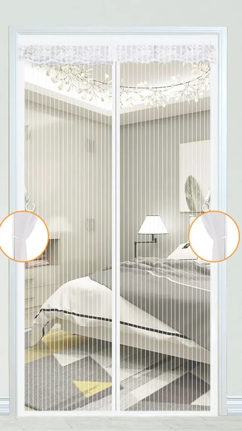 A white magnetic screen door with a mesh curtain is shown in a bedroom setting.