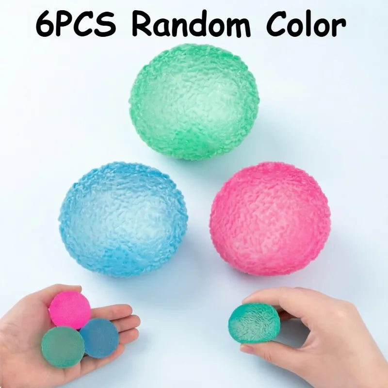 Six random colored soft textured stress balls are displayed on a white surface and in hands.