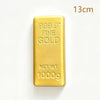 A rectangular bar of 999.9 fine gold metal weighing 1000g for stress relief.