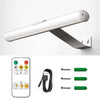 A white cordless rechargeable picture light fixture mounted on a wall, shown alongside its power cord and mounting hardware.