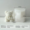 A white silicone mold shaped like a bear hugging a heart, used for DIY crafts.