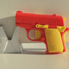 A small, red and yellow 3D printed gravity fidget pistol toy resting on a white surface.