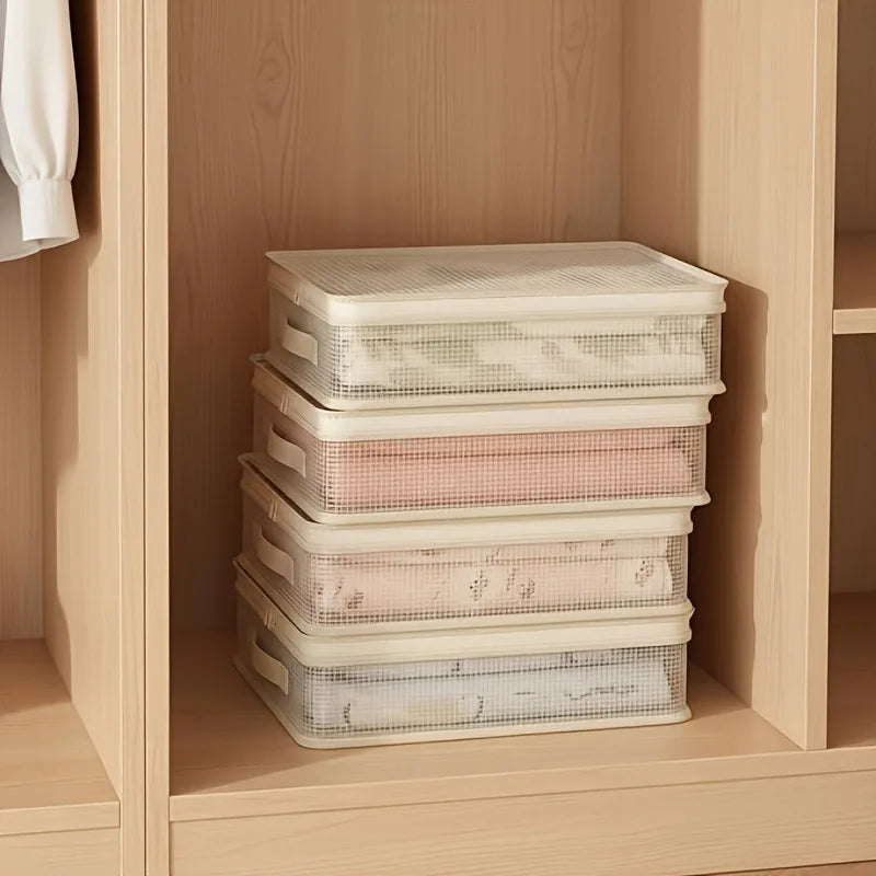 Stack of clear mesh storage bags filled with pink and white bedding inside a wooden cabinet