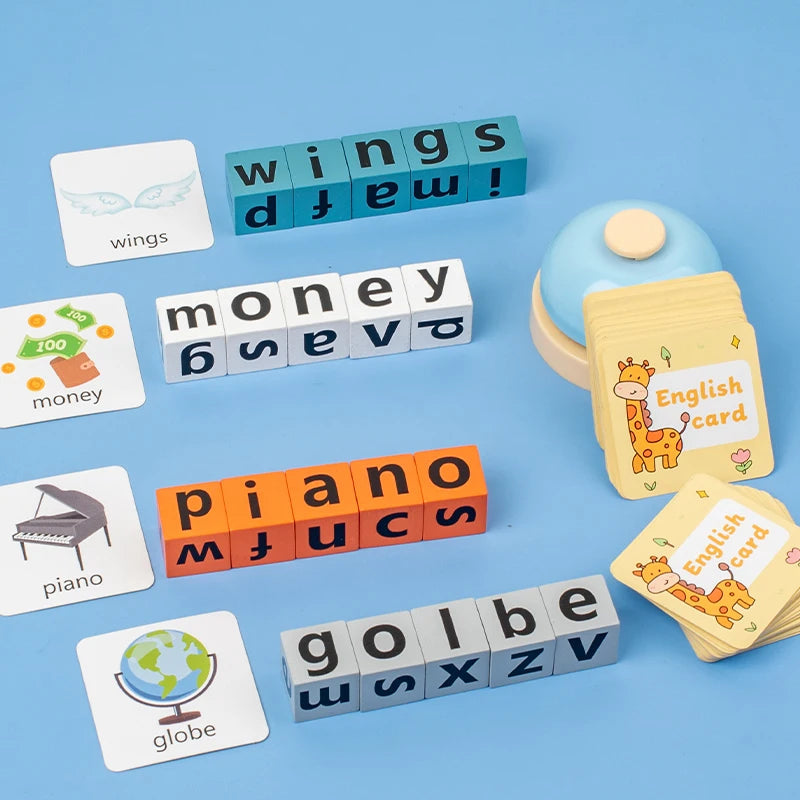 A collection of wooden letter blocks spelling words like wings, money, piano, globe, and golbe for an English learning game.