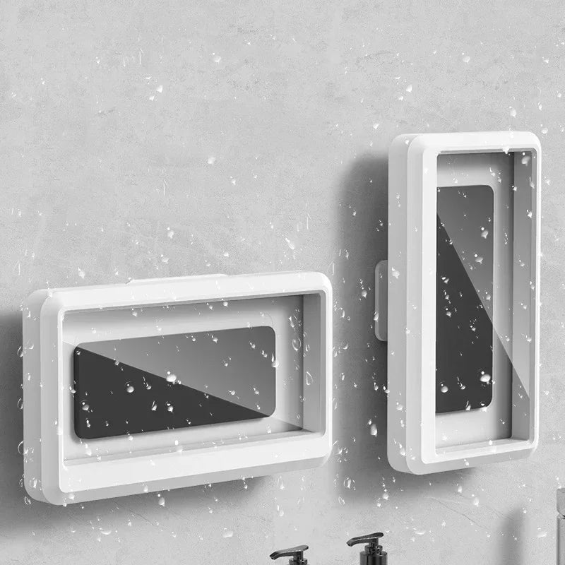 White universal waterproof shower phone case with anti-fog screen mounted on a gray wall.