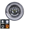 A close-up view of a 7-inch round LED headlight with a DRL halo and an amber turn signal.