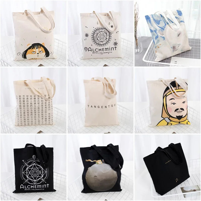 A collection of reusable canvas shopping tote bags in various colors and designs, including black, beige, and blue patterns.