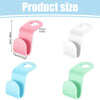 A set of three space-saving cascading hanger connectors in pink, white, and mint green showing their size.