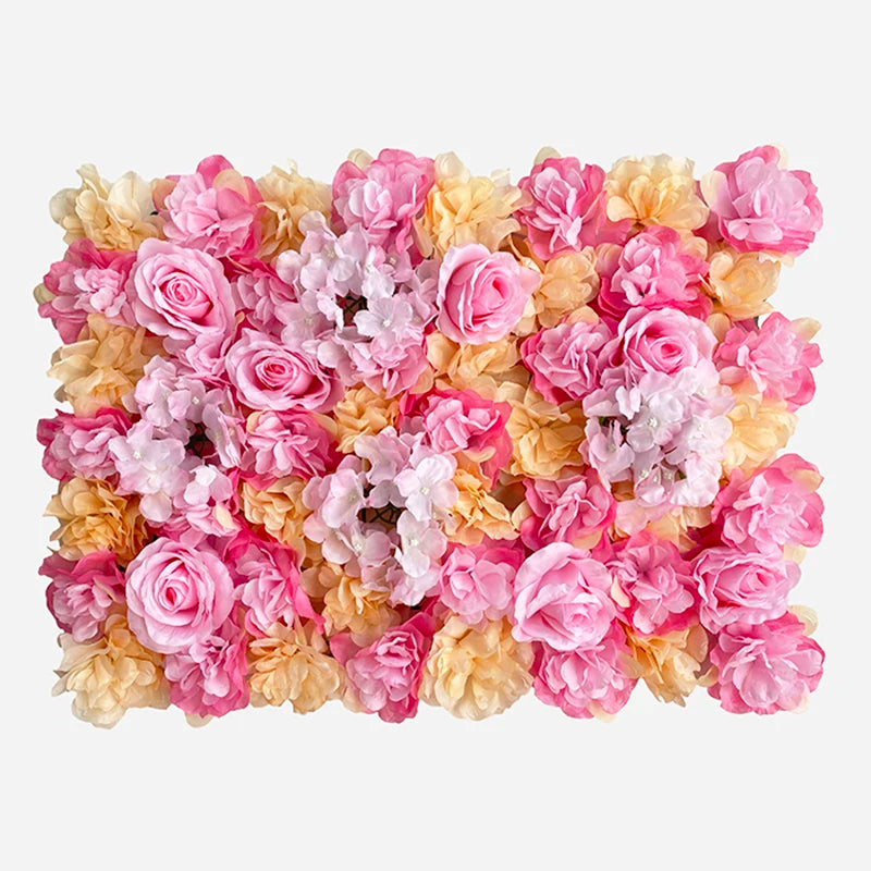 A dense wall panel of pink and peach silk rose flowers for weddings and events.