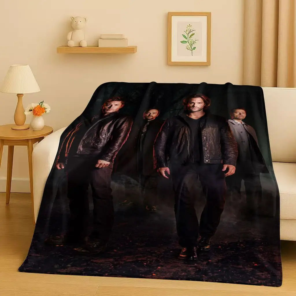 A dark blanket featuring a moody, cinematic image of several men in dark clothing.