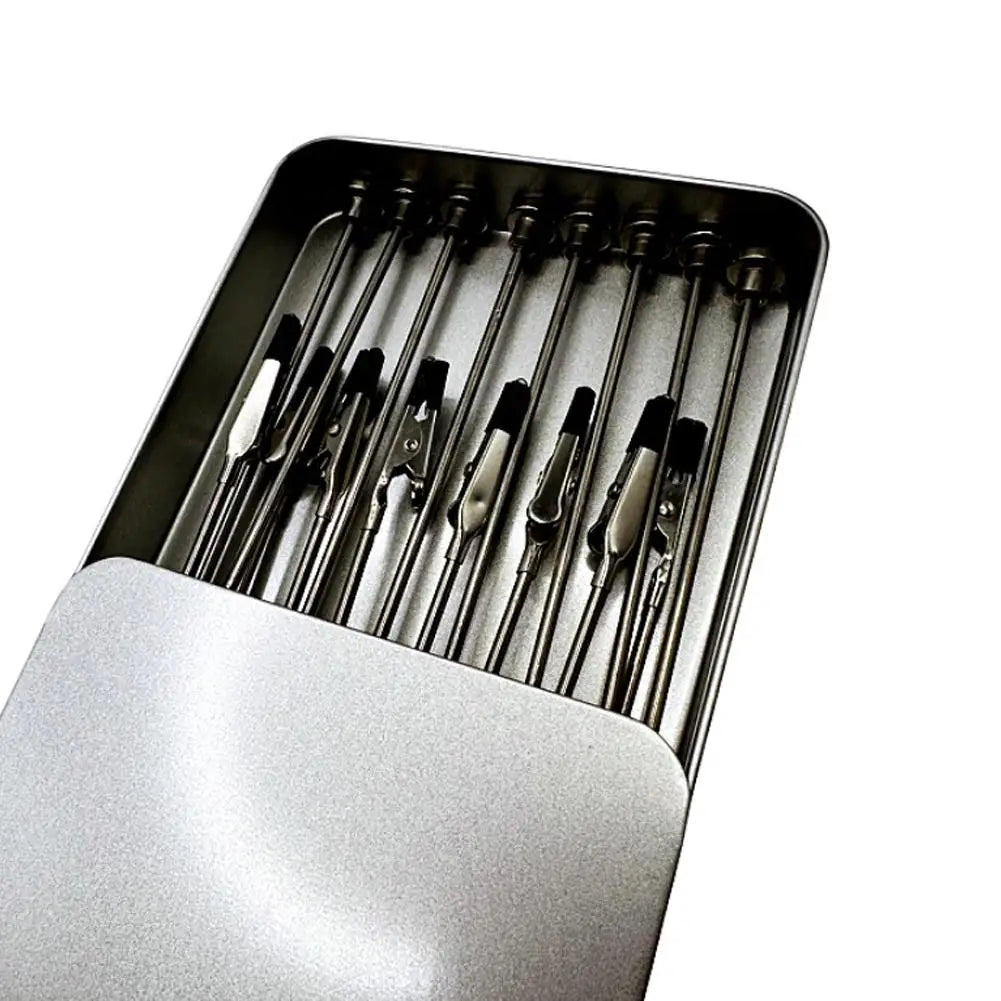 A close-up view of a magnetic helping hands tool with multiple flexible gooseneck arms and alligator clips inside a metal hol