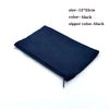 A black foldable canvas tote bag with a zipper, shown flat.