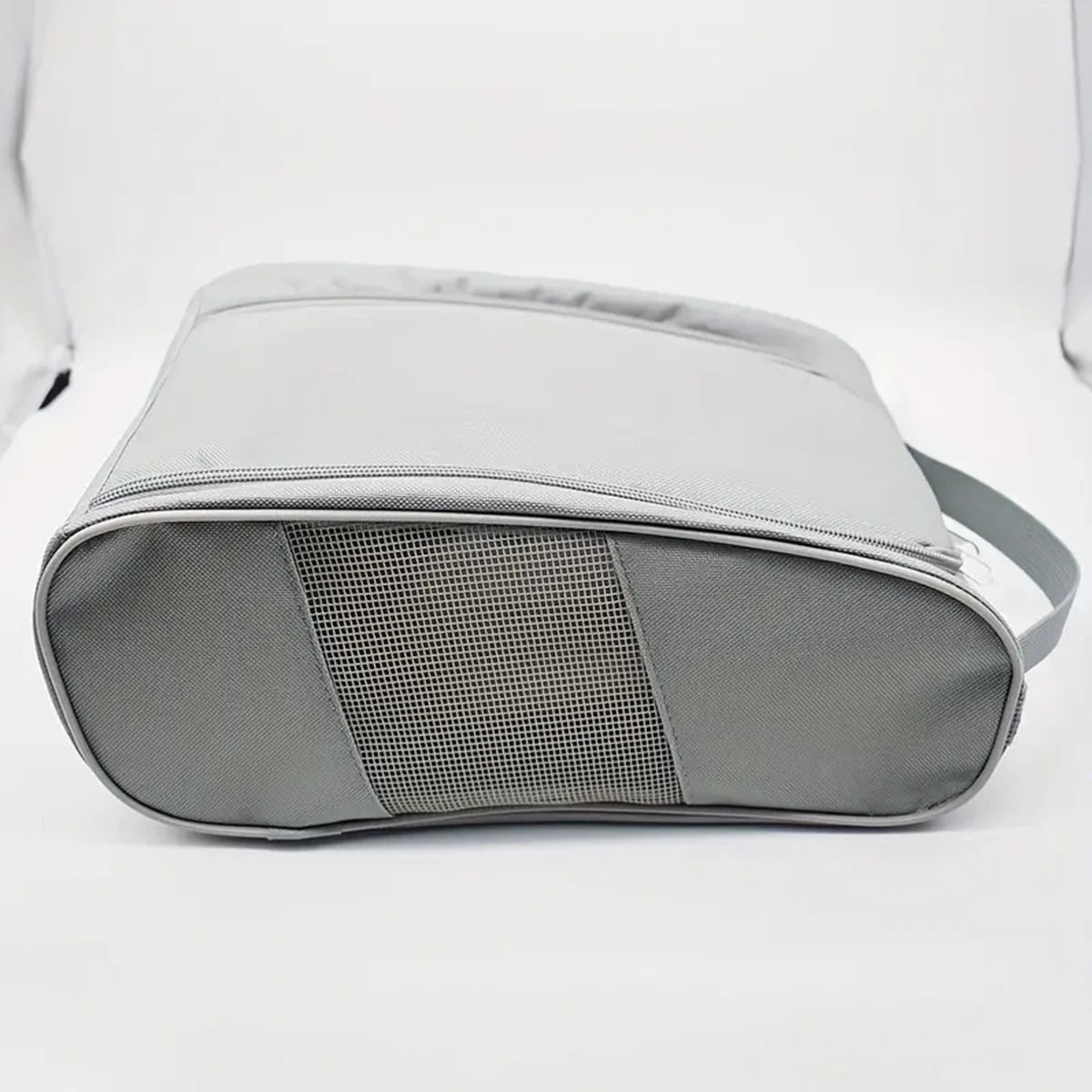 A gray breathable oxford cloth shoe storage bag shown from the side.