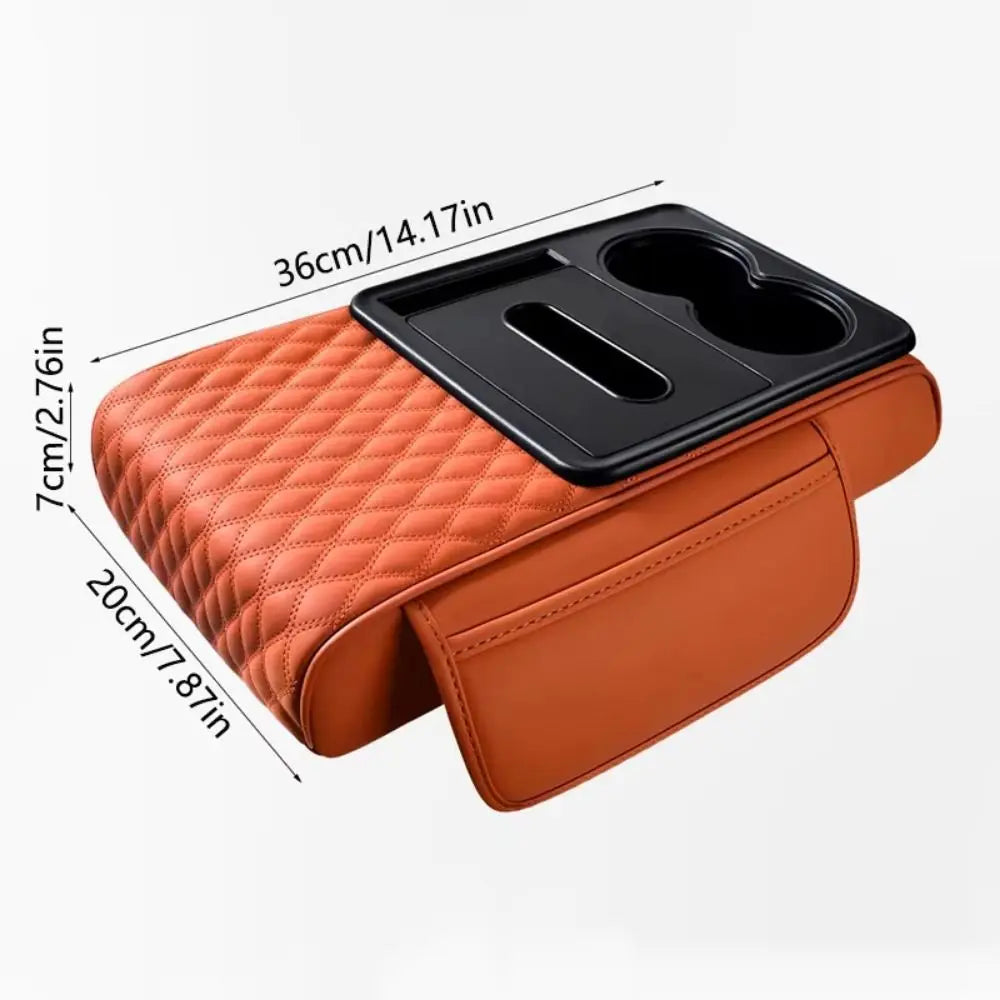 Orange quilted car armrest cushion with storage and cup holders shown from above.