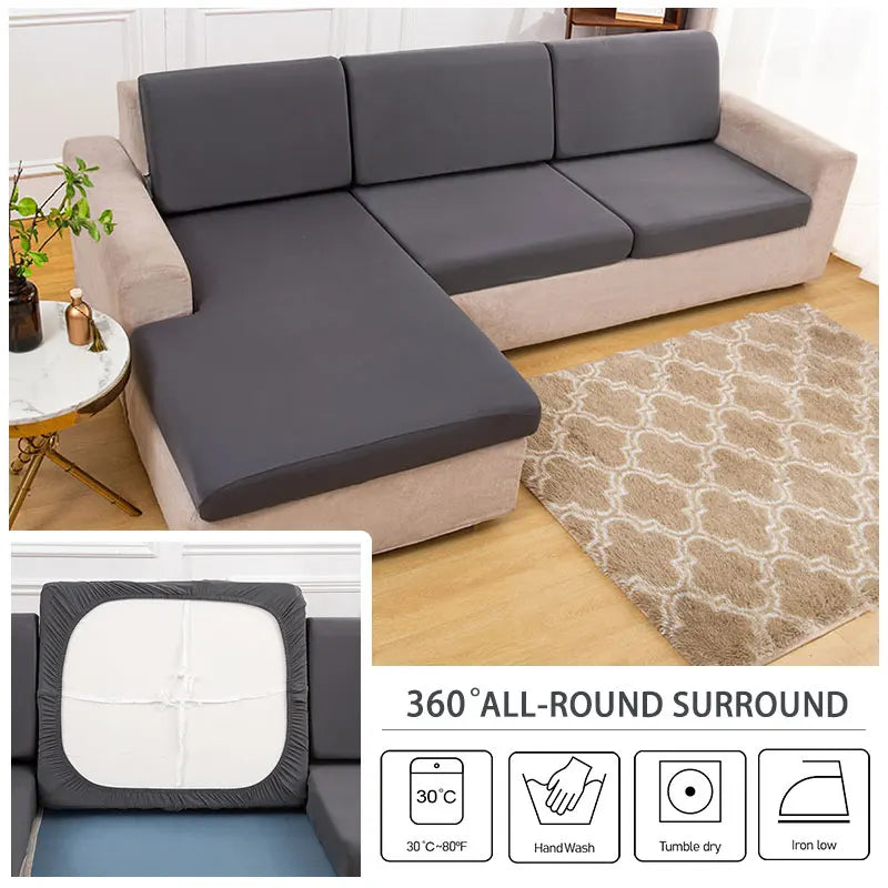 A gray sofa cushion cover displayed on a beige sofa, with icons showing washing instructions.
