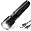A black high-lumen rechargeable LED flashlight with a silver lens and a detachable connector.