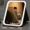 A portable touch vanity mirror with customizable LED lights showing dimming, color matching, and highlight functions.