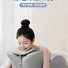 A woman is relaxing on a bed using a gray ergonomic memory foam wedge pillow for comfortable and relaxing support.