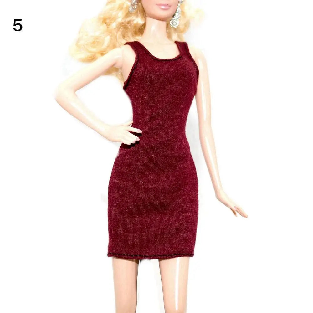 A fashion doll wearing a deep burgundy sleeveless mini dress.