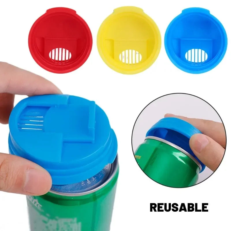 A set of reusable leakproof can covers in red, yellow, and blue, shown alongside a green soda can.