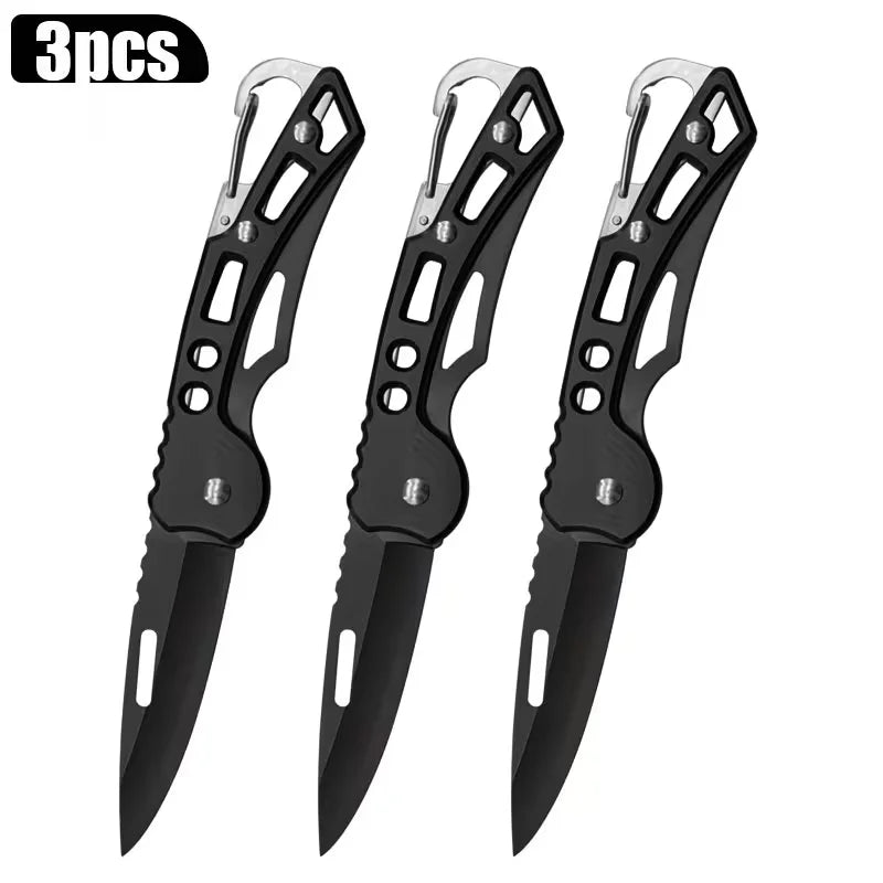 A set of three black stainless steel folding knives with compact designs.