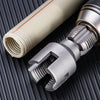 A close-up of an integrated pipe threading tool with a silver body and a white threaded tube, shown against a dark background