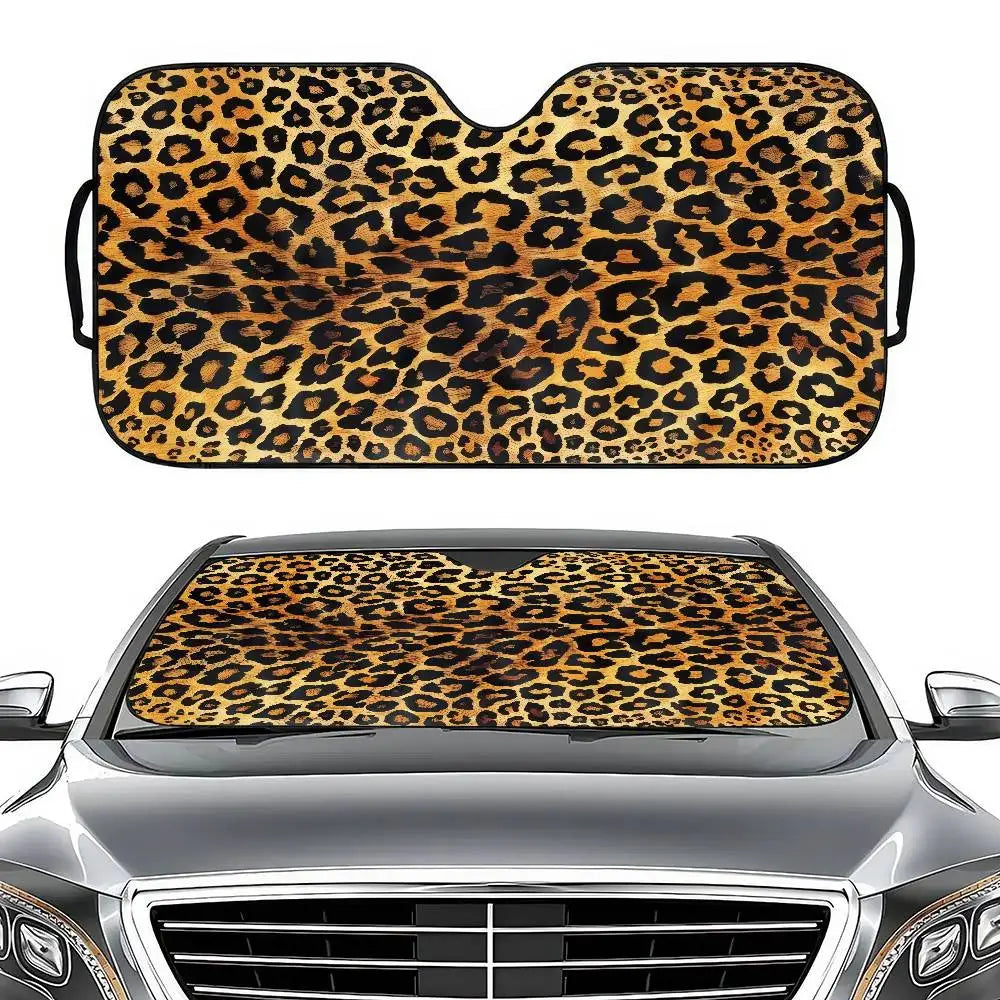 Leopard print car windshield sunshade placed on a silver car hood.