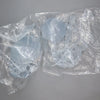 A clear plastic bag contains several light blue articulated BJD collectible figurine parts.