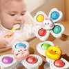 A set of spinning bath toys for toddlers featuring various colored, foam-like wheels and a yellow duck.