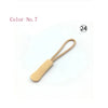 A single light beige plastic zipper pull is shown against a white background.