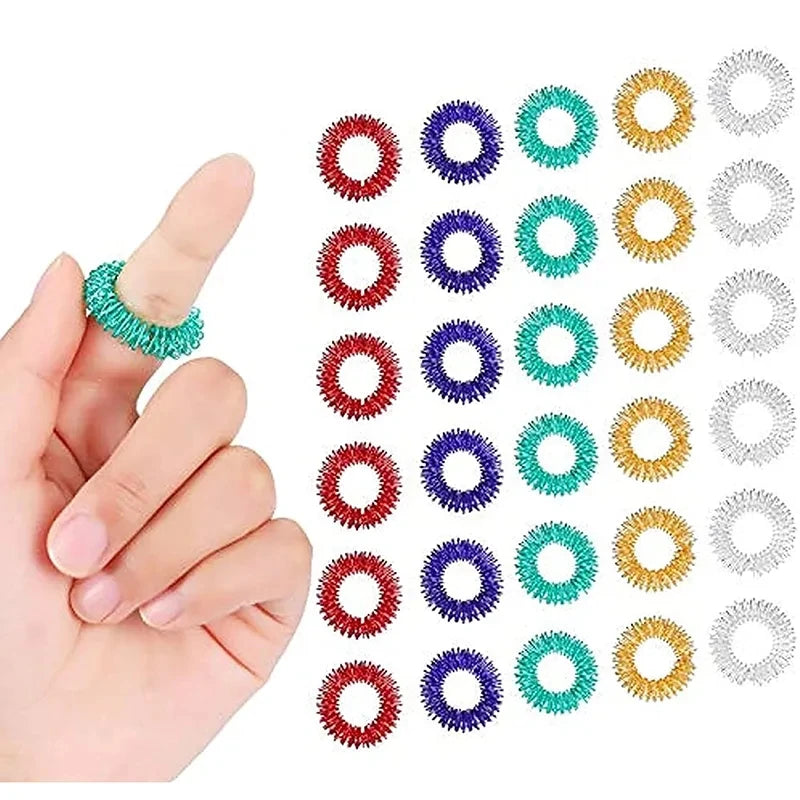 A hand holds a set of 3 soft foam sports stress balls in various colors and textures.