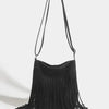 A black bohemian fringe shoulder bag with long dangling tassels.