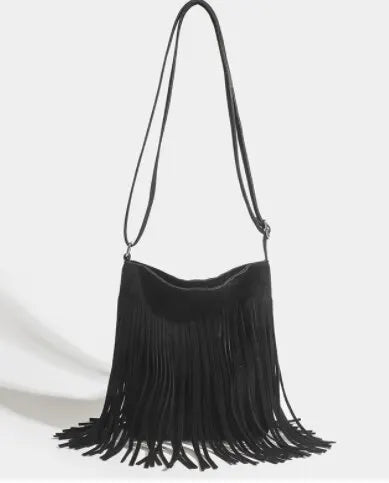 A black bohemian fringe shoulder bag with long dangling tassels.