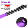 A black mini flashlight with a pen clip emitting purple UV light.