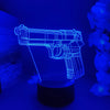 A glowing blue gun-shaped night light illuminates a dark background.