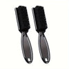 A pair of black grooming brushes for beard and hair